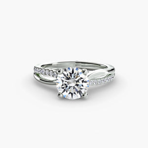 The Split Shank Pavé Solitaire - elegant engagement ring with a central diamond and a split band adorned with pavé diamonds for added sparkle