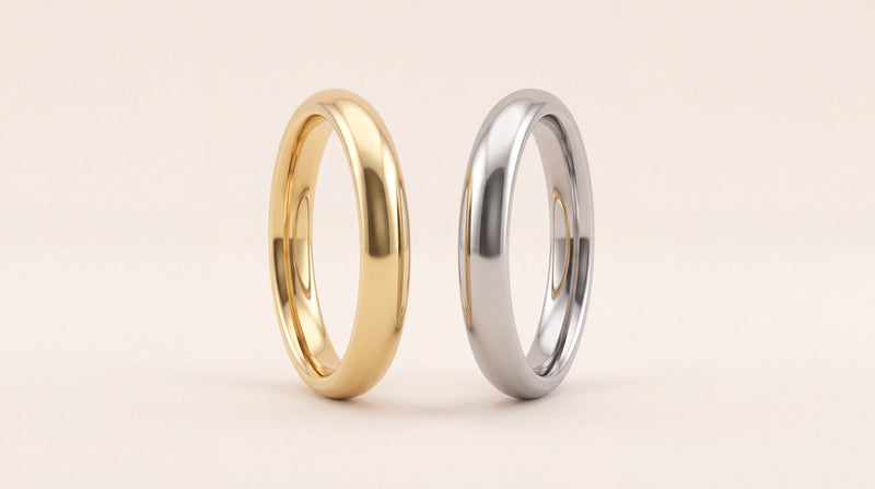 Design preview of two plain court wedding rings, one in yellow gold and one in a white metal, on ivory