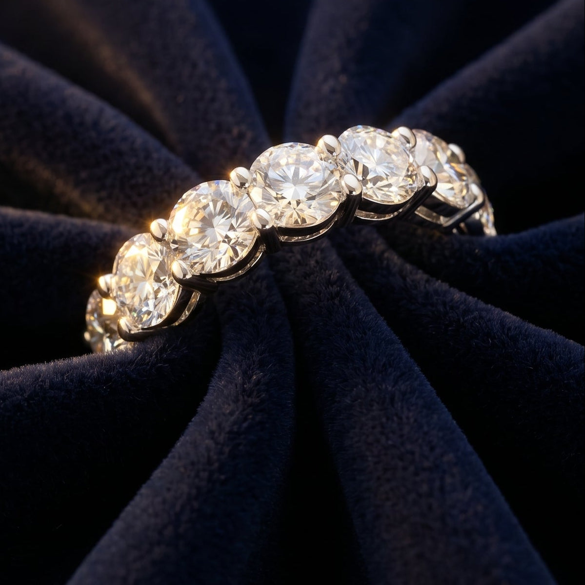 Diamond ring on a dark blue fabric background