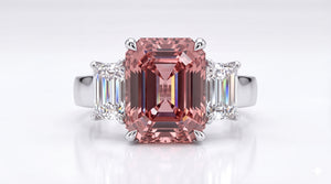 Bespoke emerald-cut morganite ring with baguette diamonds, made in Hatton Garden