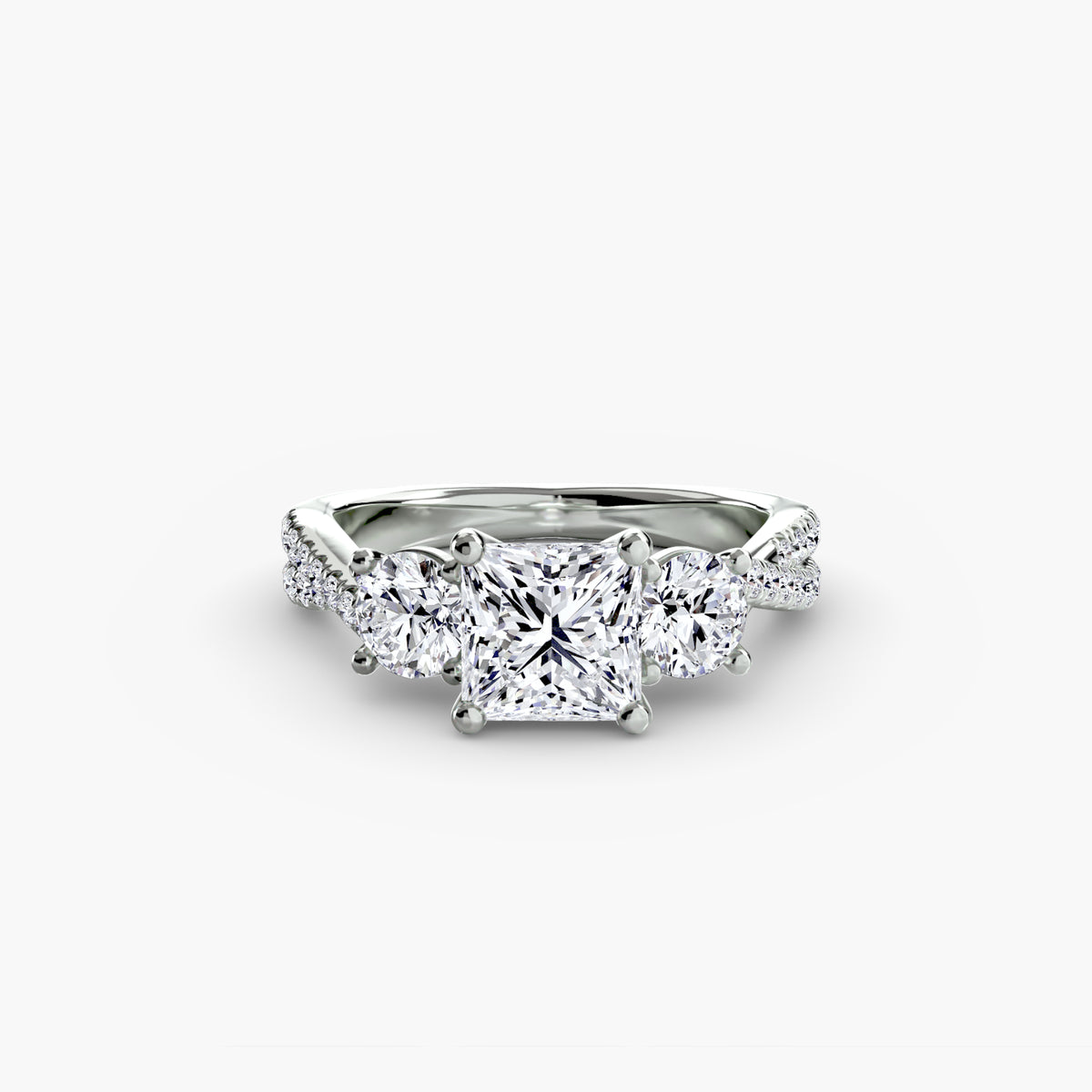 Three-stone ring with pavé band 2 - timeless engagement ring featuring a central diamond with side stones and pavé detailing on the band