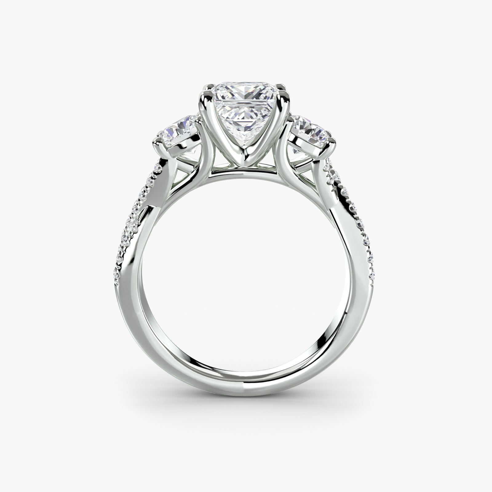 Three-stone ring with pavé band 2 - timeless engagement ring featuring a central diamond with side stones and pavé detailing on the band