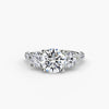 Three-stone ring with pavé band 3 - timeless engagement ring featuring a central diamond and two side stones with pavé detailing on the band