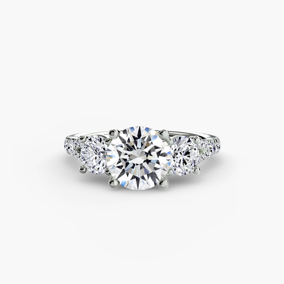 Three-stone ring with pavé band 3 - timeless engagement ring featuring a central diamond and two side stones with pavé detailing on the band