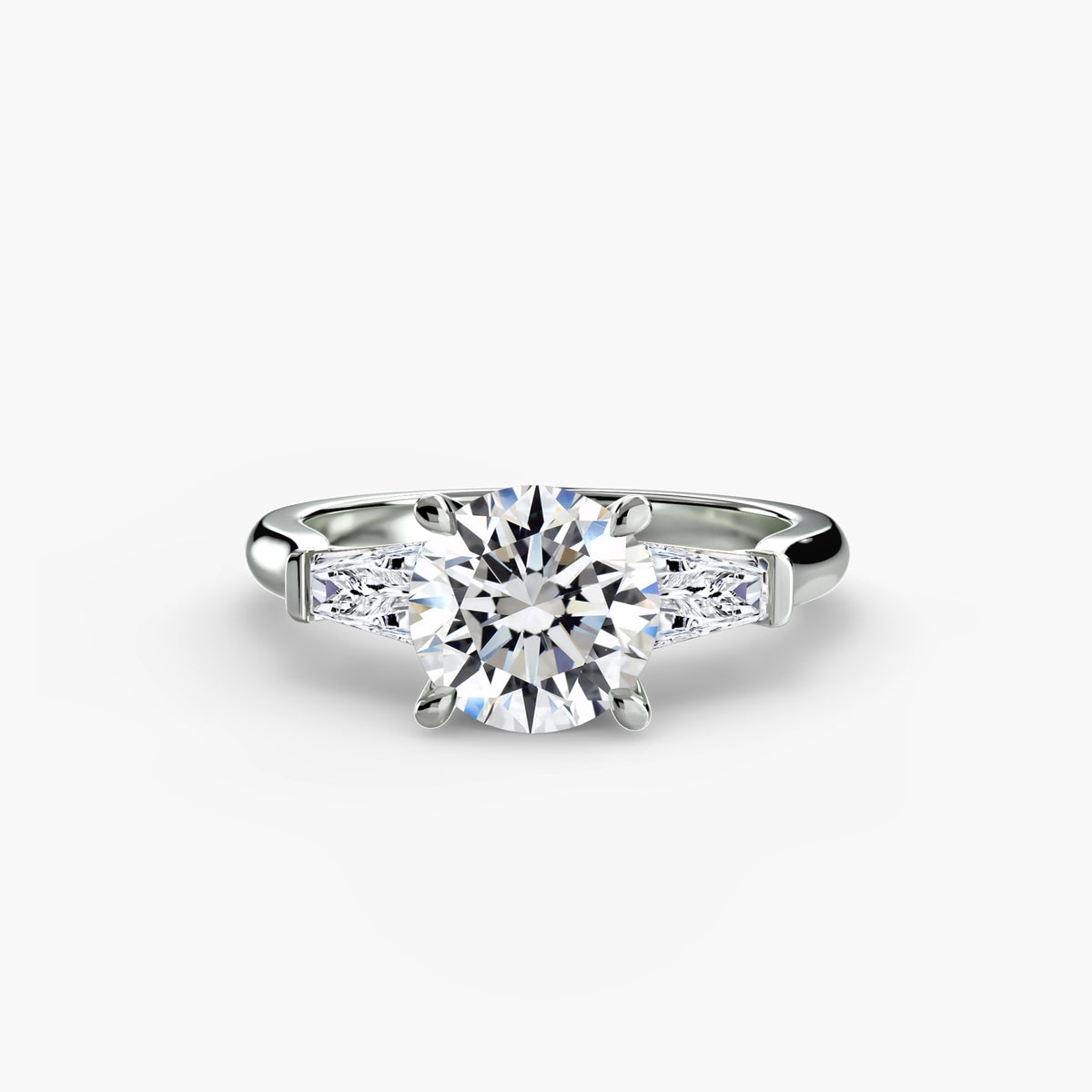 Three-stone ring with baguette side stones - elegant engagement ring featuring a central diamond with sleek baguette diamonds on the sides