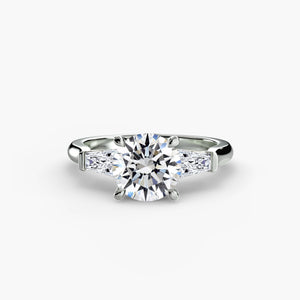 Three-stone ring with baguette side stones - elegant engagement ring featuring a central diamond with sleek baguette diamonds on the sides