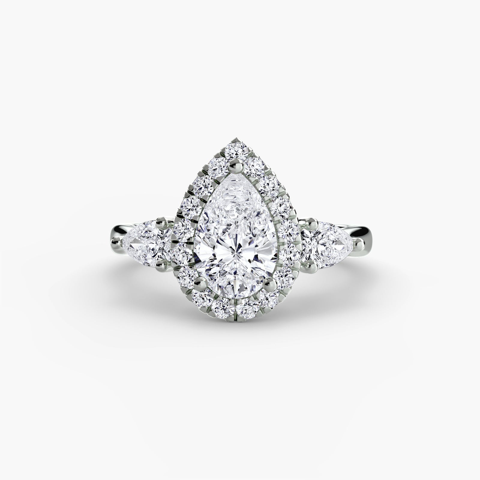 The Pear Halo Three-Stone, a made-to-order diamond engagement ring from Hatton Garden Bespoke Jewellery