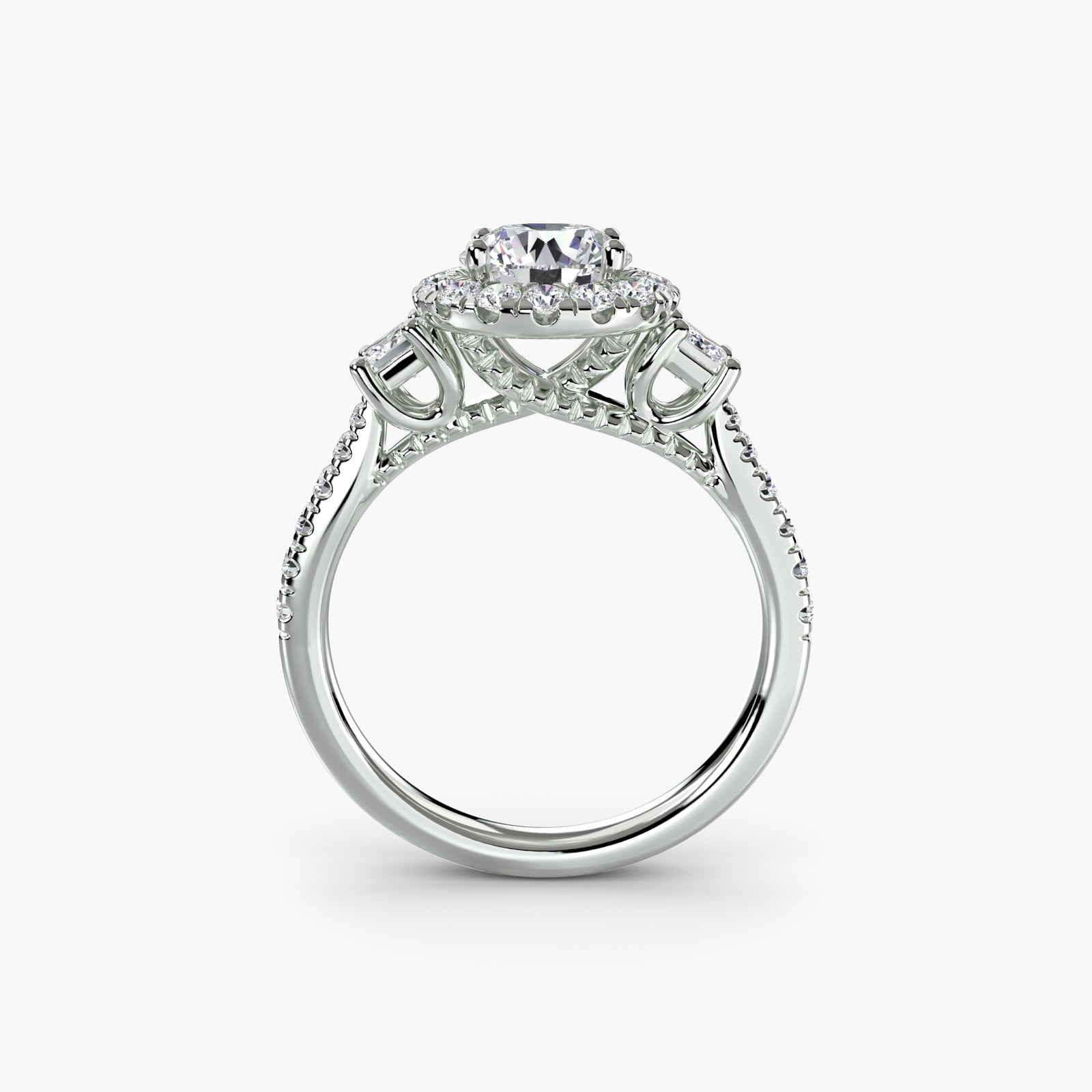 Three-stone ring with halo 2 - elegant engagement ring featuring a central diamond flanked by two side stones, surrounded by a sparkling halo
