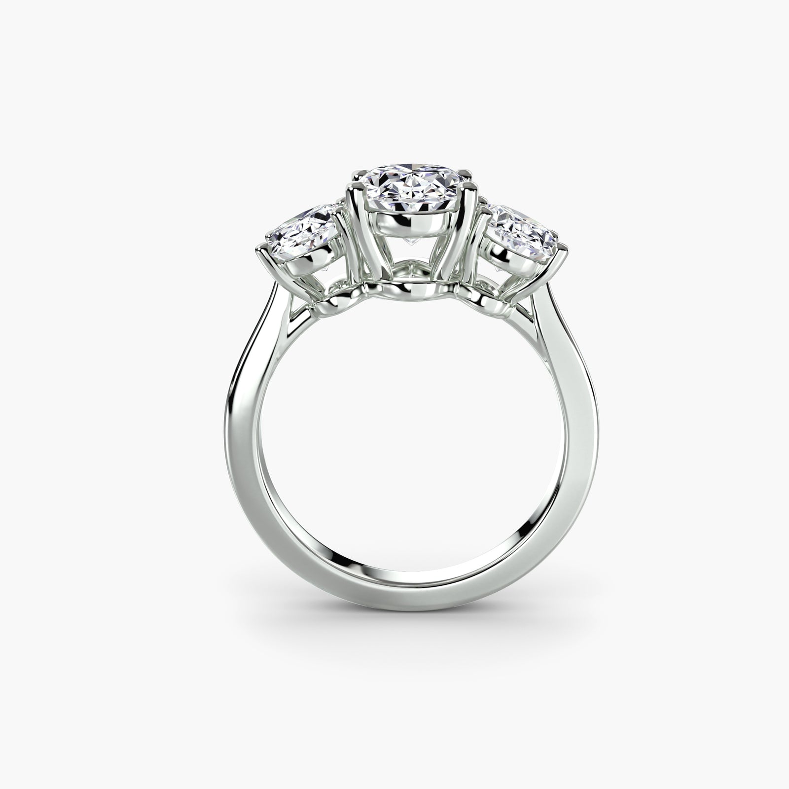 Trilogy Oval ring - classic three-stone engagement ring featuring an oval center diamond with two side diamonds