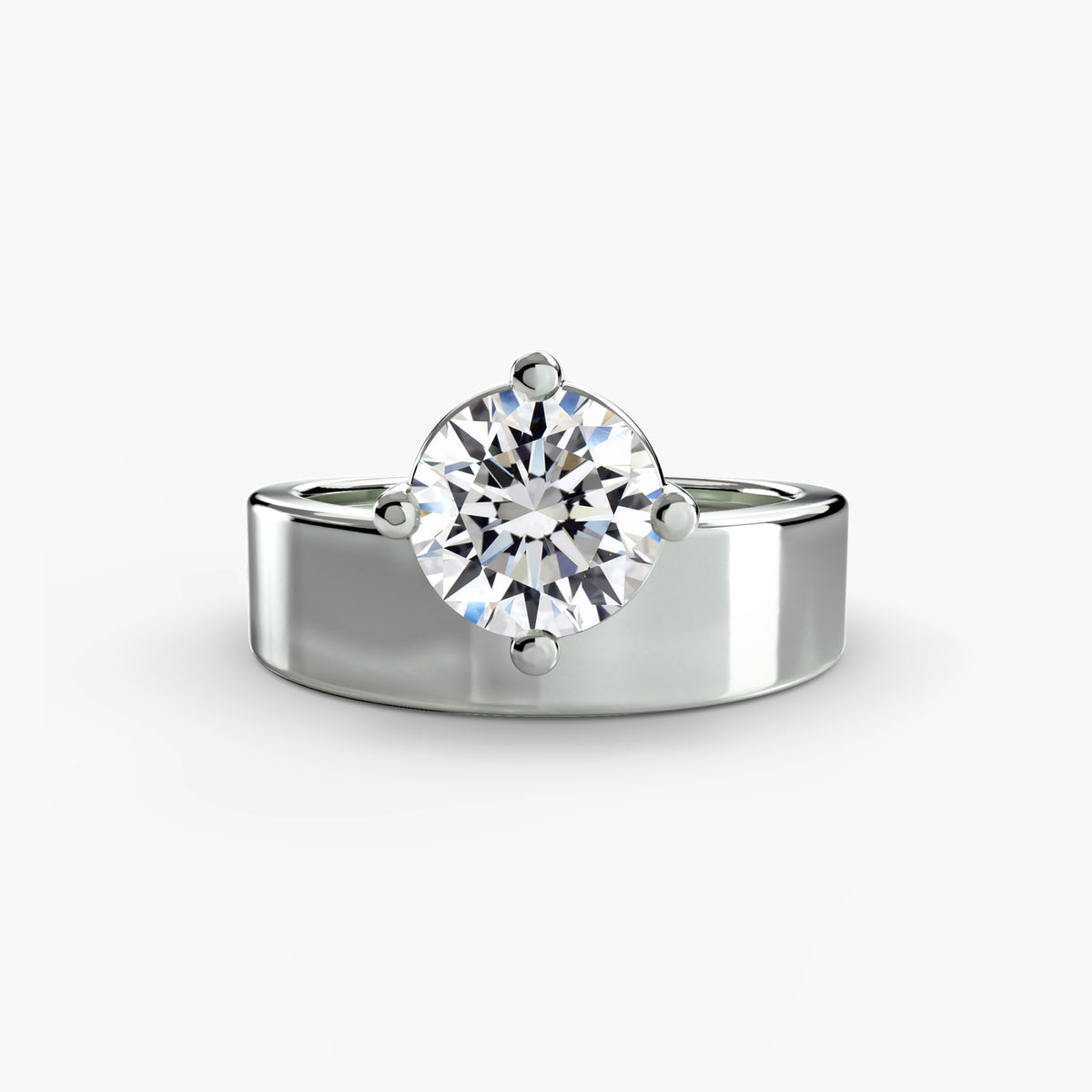 Wide band solitaire - elegant engagement ring featuring a single diamond set on a broad, sleek band
