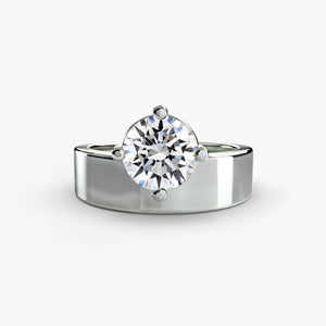 Wide band solitaire - elegant engagement ring featuring a single diamond set on a broad, sleek band