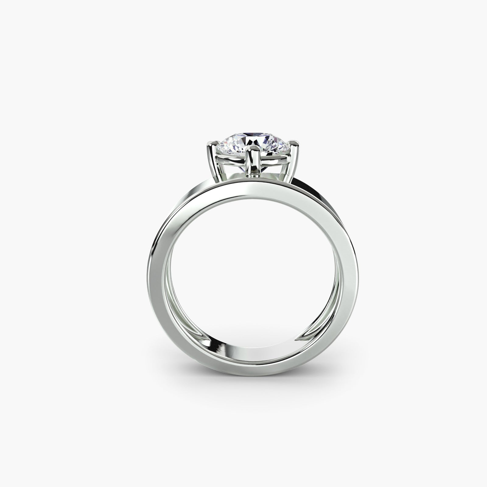 Wide band solitaire - elegant engagement ring featuring a single diamond set on a broad, sleek band