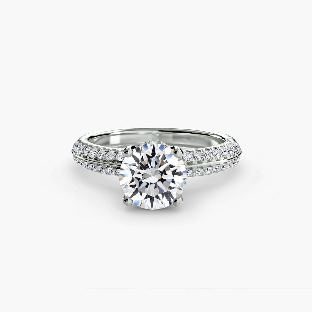 Solitaire with pavé - timeless engagement ring featuring a central diamond with pavé diamond detailing on the band