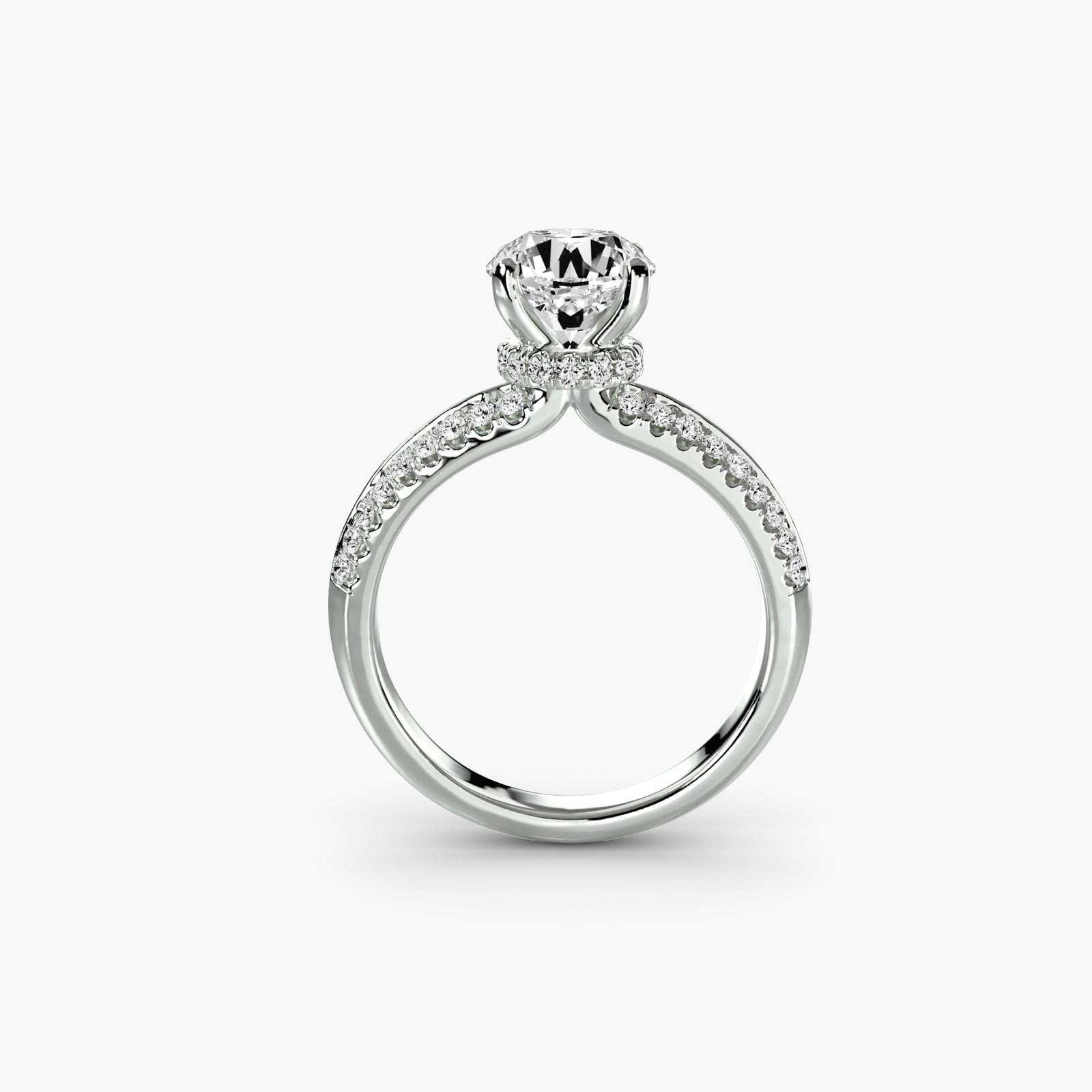 Solitaire with pavé - timeless engagement ring featuring a central diamond with pavé diamond detailing on the band
