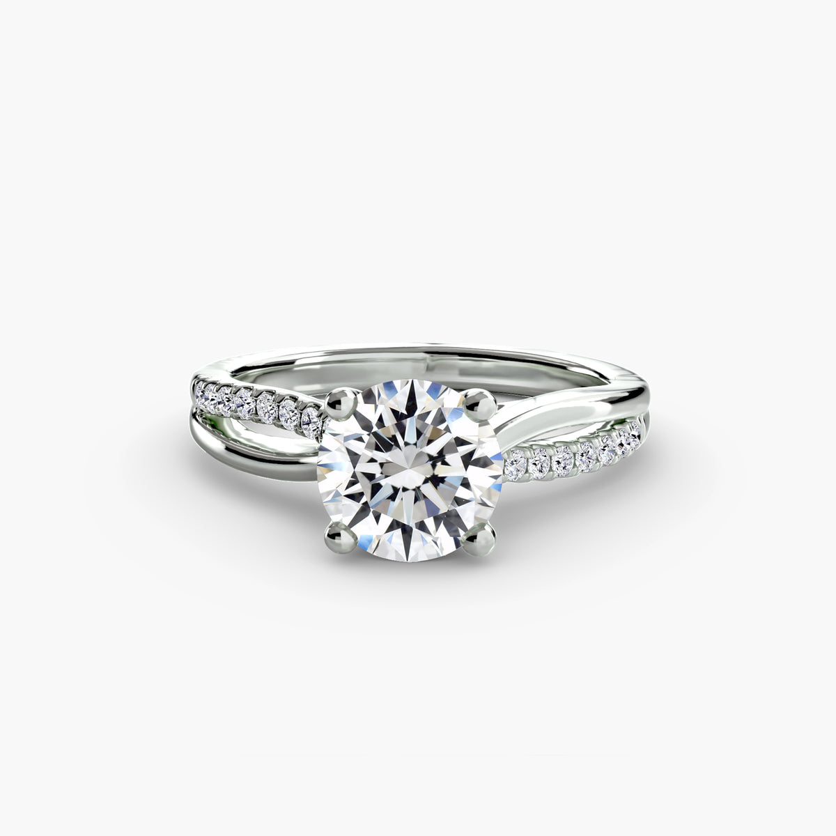 The Split Shank Pavé Solitaire - elegant engagement ring with a central diamond and a split band adorned with pavé diamonds for added sparkle