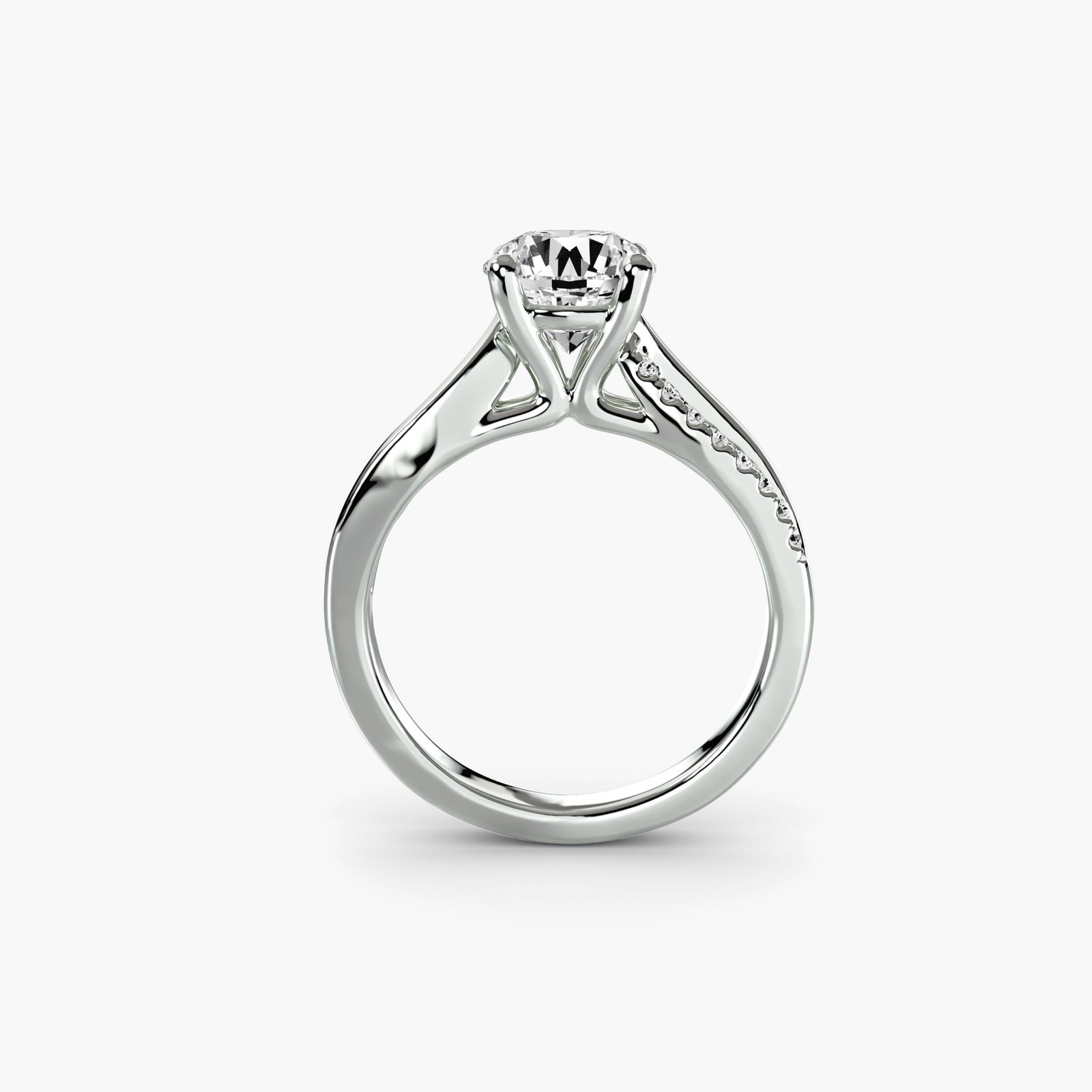 The Split Shank Pavé Solitaire - elegant engagement ring with a central diamond and a split band adorned with pavé diamonds for added sparkle