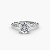 The Floral Accent Solitaire - elegant engagement ring featuring a central diamond with delicate floral-inspired accents on the band