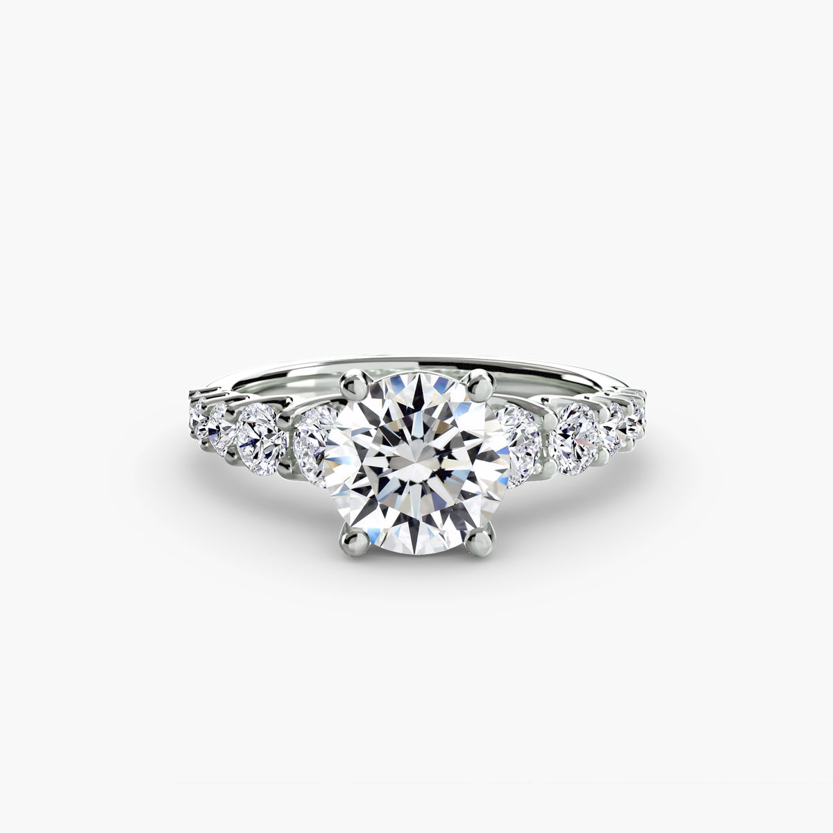 The Graduated Accent Ring - sophisticated design featuring a central diamond with graduated accent diamonds for added elegance