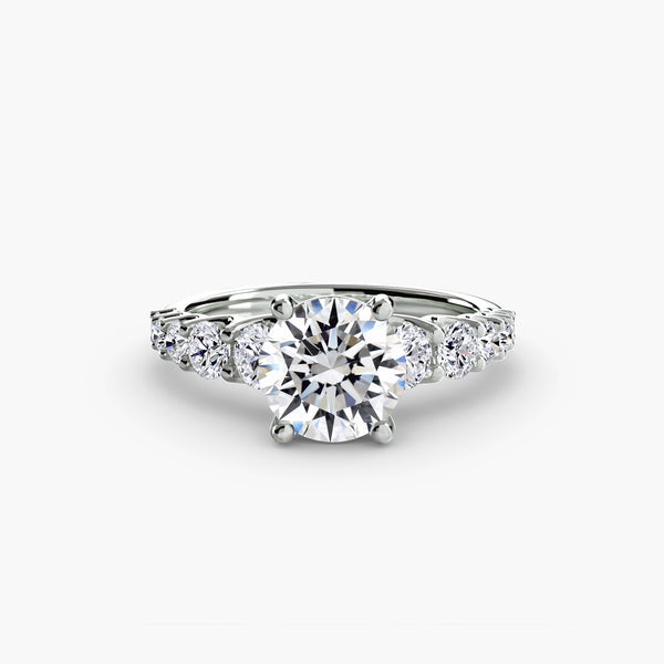The Graduated Accent Ring - sophisticated design featuring a central diamond with graduated accent diamonds for added elegance