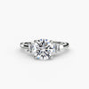 “Baguette accent solitaire - classic engagement ring featuring a central diamond with elegant baguette diamond accents on the band