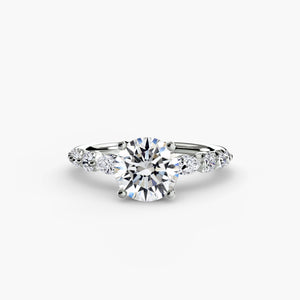 The Tiered Accent Ring - elegant design featuring a central diamond with tiered accent diamonds on the band for a sophisticated look
