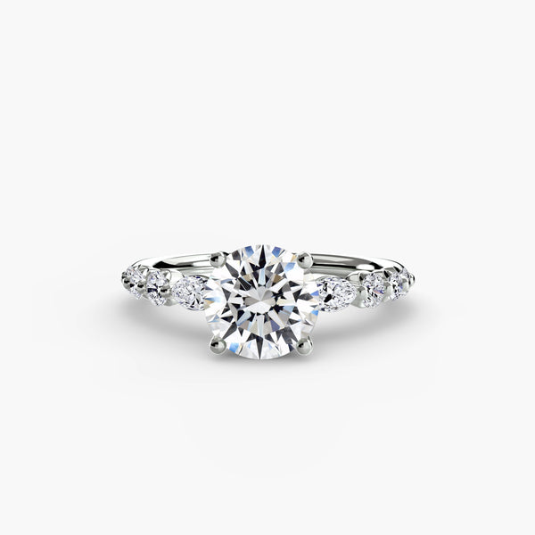 The Tiered Accent Ring - elegant design featuring a central diamond with tiered accent diamonds on the band for a sophisticated look