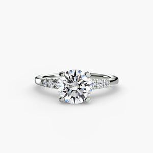 Solitaire with shoulder accents - classic engagement ring featuring a central diamond with accent diamonds on the shoulders for added sparkle
