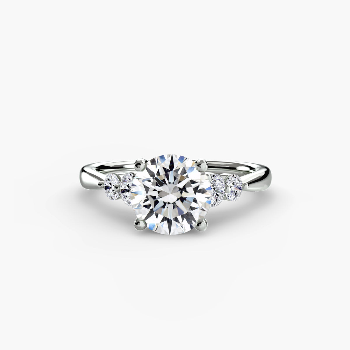 Solitaire with shoulder accents 2 - elegant engagement ring featuring a central diamond with accent diamonds on the shoulders