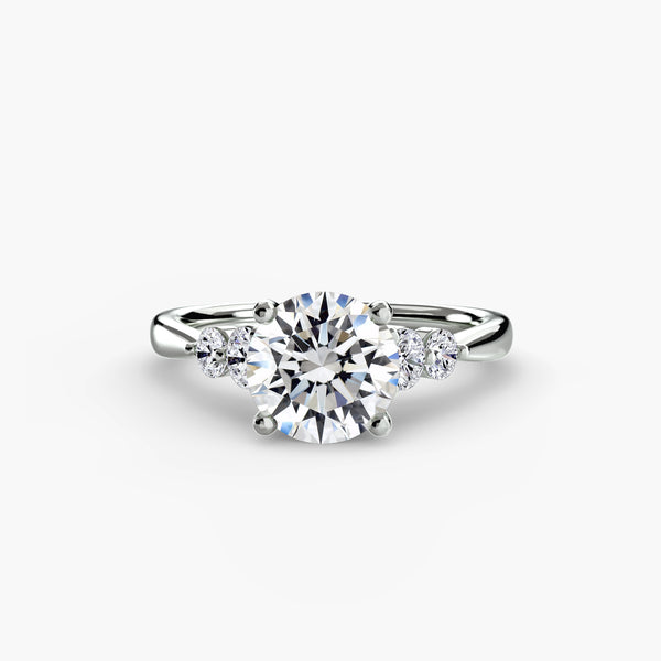 Solitaire with shoulder accents 2 - elegant engagement ring featuring a central diamond with accent diamonds on the shoulders