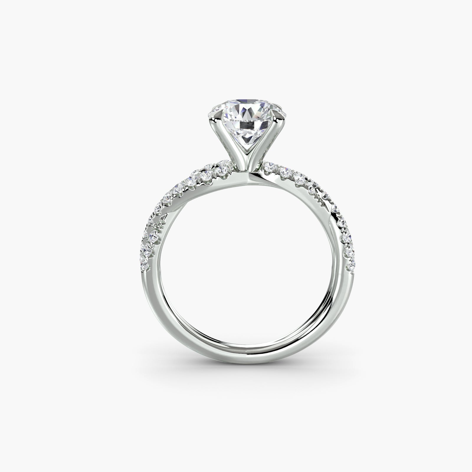 The Twisted Pavé Solitaire - elegant solitaire engagement ring with a twisted band adorned with pavé diamonds