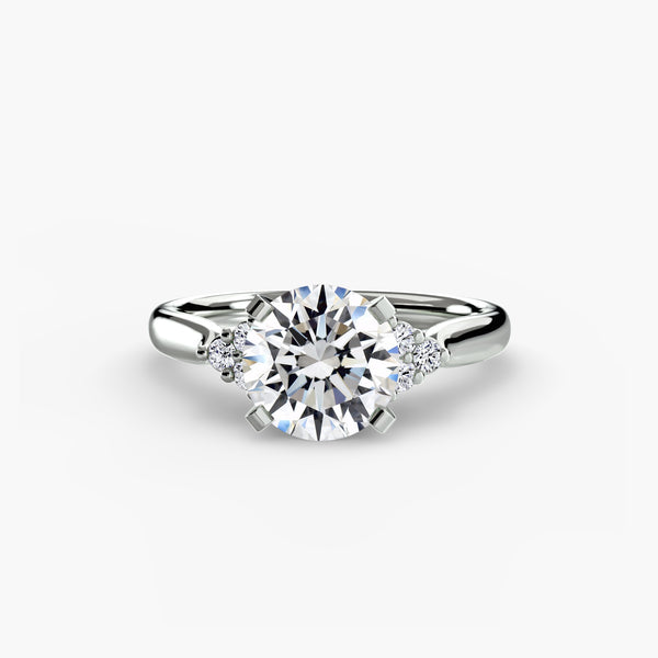 Solitaire with cluster shoulders 2 - elegant engagement ring featuring a central diamond with diamond clusters on the shoulders