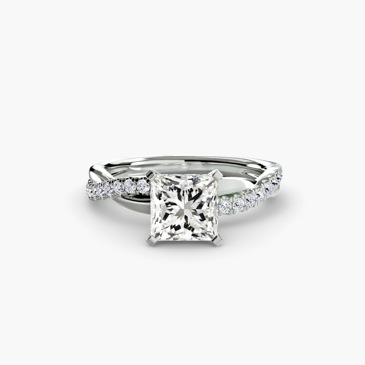 The Emerald Twist Pavé Ring - elegant twist design with emerald-cut diamond and pavé band for a modern, sophisticated look