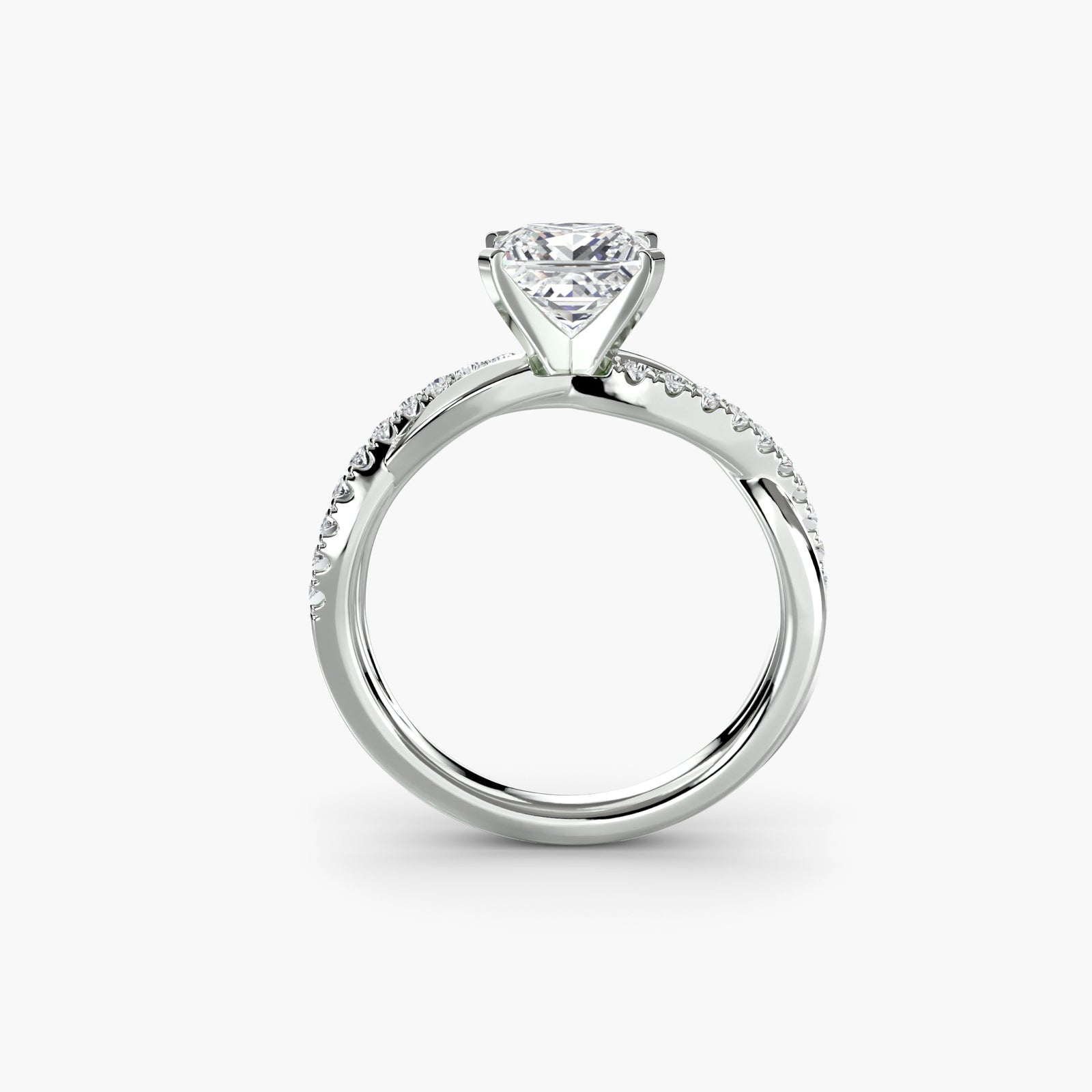 The Emerald Twist Pavé Ring - elegant twist design with emerald-cut diamond and pavé band for a modern, sophisticated look