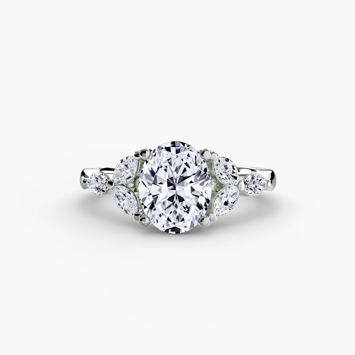 The Shoulder Cluster Ring - elegant design featuring a central diamond with a cluster of smaller diamonds on the shoulders