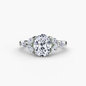 The Shoulder Cluster Ring - elegant design featuring a central diamond with a cluster of smaller diamonds on the shoulders