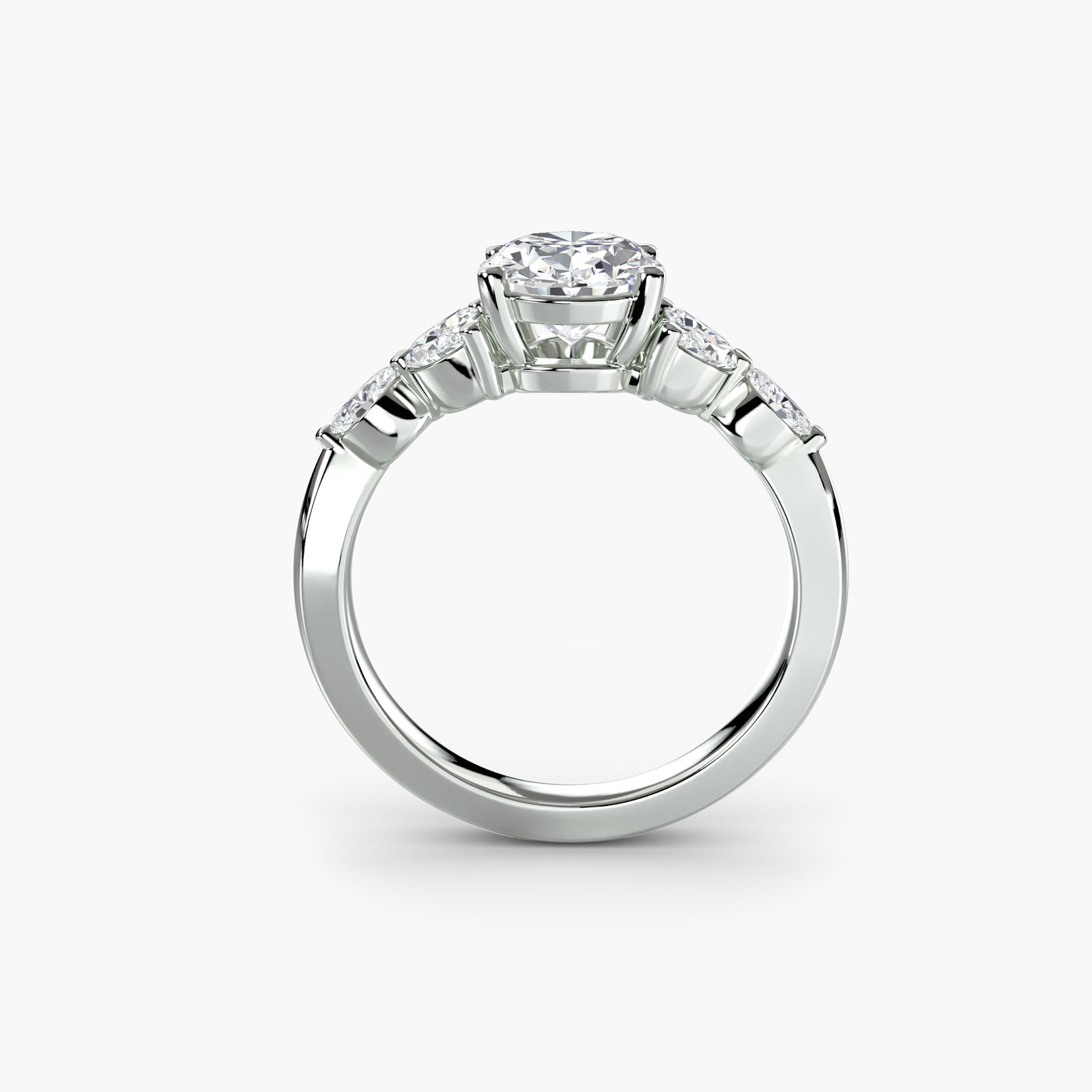 The Shoulder Cluster Ring - elegant design featuring a central diamond with a cluster of smaller diamonds on the shoulders