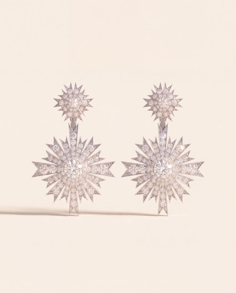 A pair of diamond starburst drop earrings