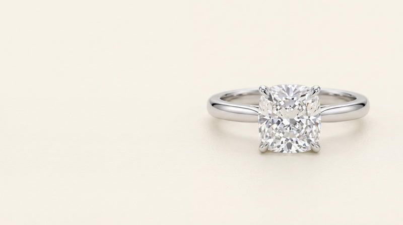 Cushion cut diamond solitaire engagement ring in platinum