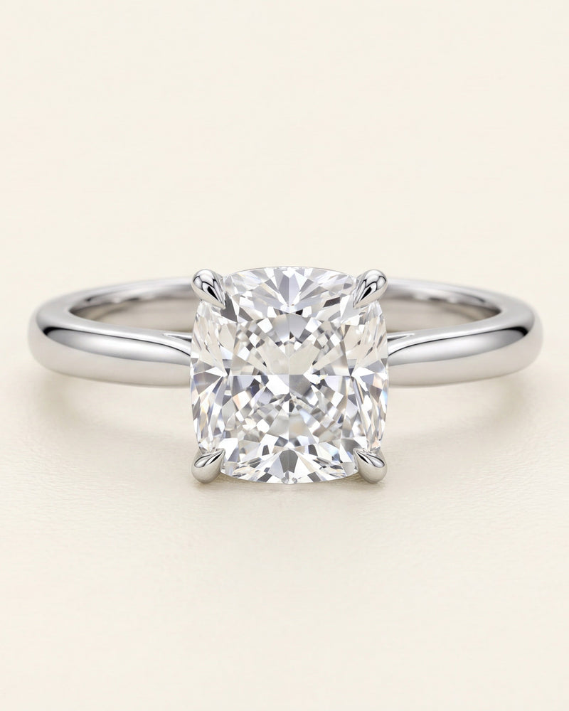 Cushion cut diamond solitaire engagement ring in platinum