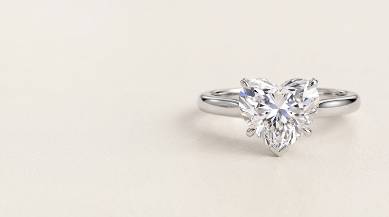 Heart shaped diamond solitaire engagement ring in platinum