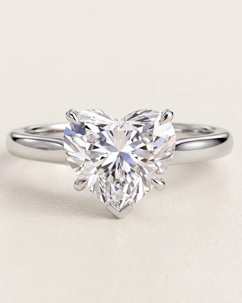 Heart shaped diamond solitaire engagement ring in platinum
