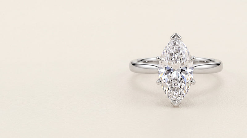Marquise cut diamond solitaire engagement ring in platinum