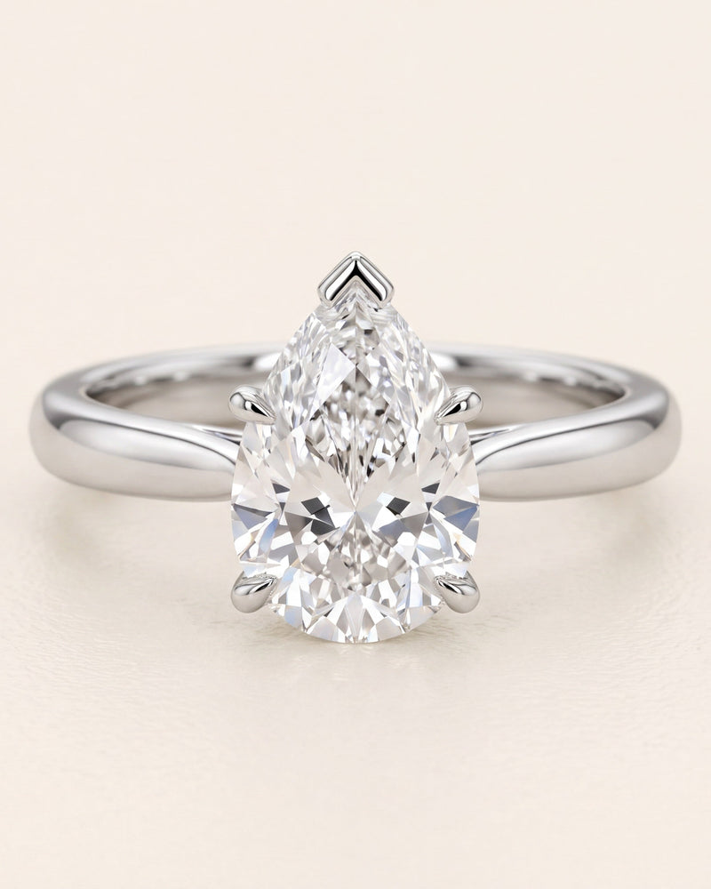Pear shaped diamond solitaire engagement ring in platinum