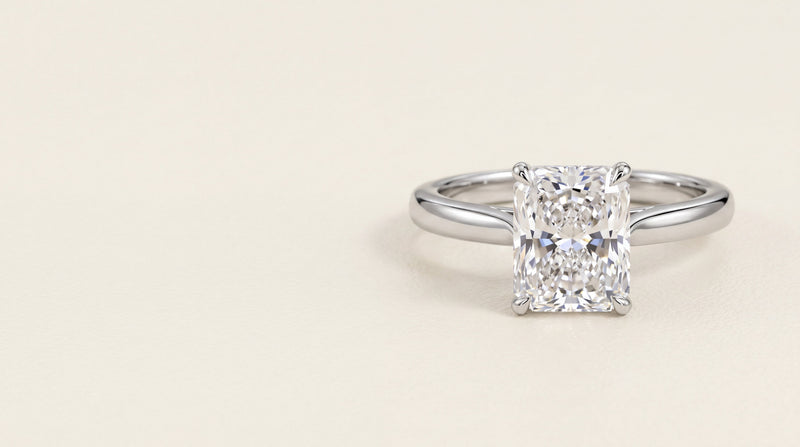 Radiant cut diamond solitaire engagement ring in platinum