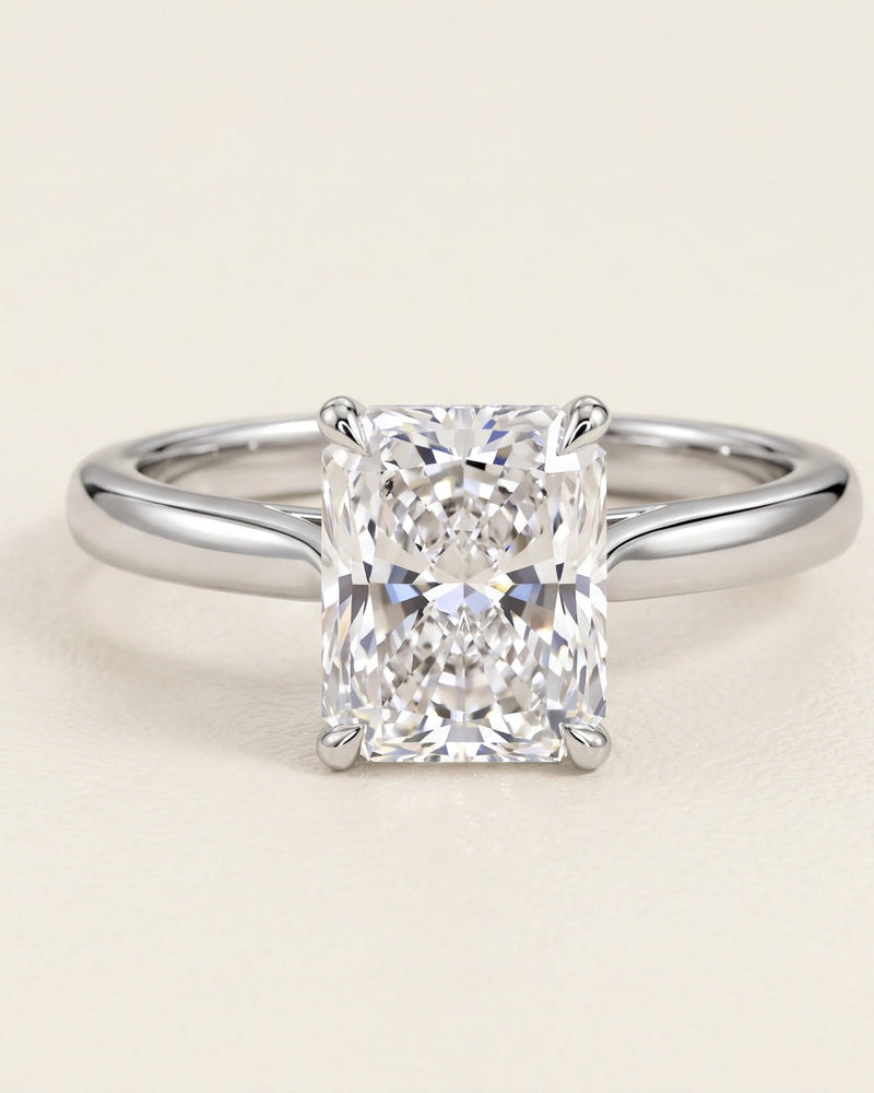 Radiant cut diamond solitaire engagement ring in platinum