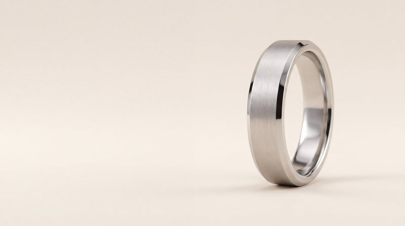 Gents flat profile wedding ring with bevelled edges and a brushed finish in platinum
