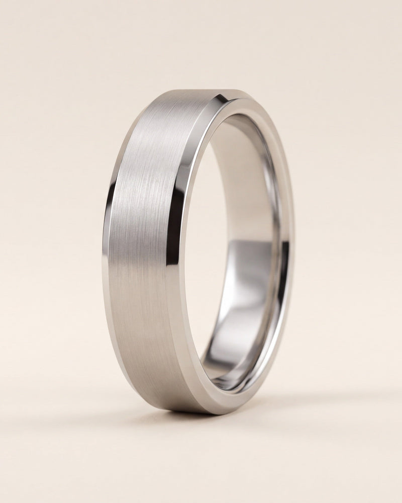 Gents flat profile wedding ring with bevelled edges and a brushed finish in platinum